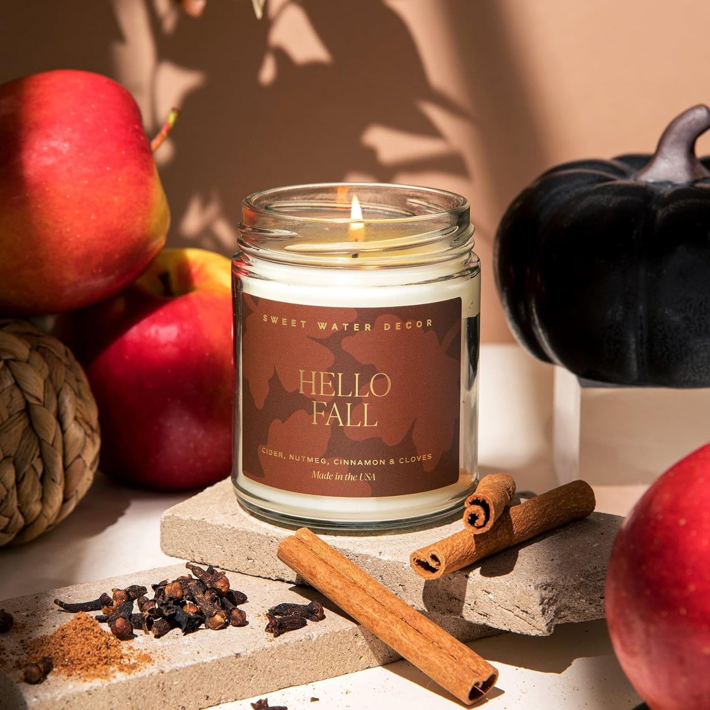 Sweet Water Decor Hello Fall Candle - Cinnamon Apples Cloves & Nutmeg Fall Scented Candle for Home Decor - 100% Cotton Wick Halloween Candle with 40 Hour Burn Time - Made in the USA - 9oz Clear Jar